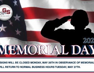 Silhouette of a soldier saluting in front of an American flag background.